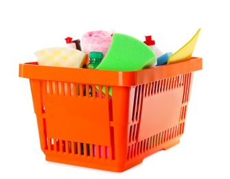 Shopping basket full of detergents on white background