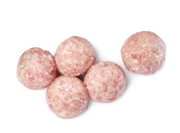 Many fresh raw meatballs on white background, top view