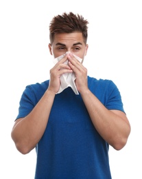 Young man suffering from allergy on white background