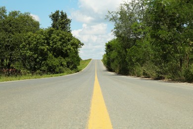 Photo of Picturesque view of empty road near trees