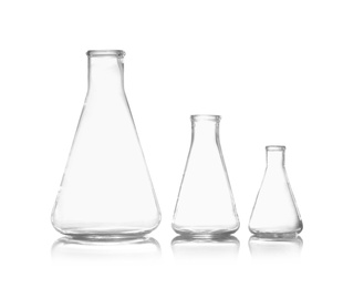 Photo of Empty conical flasks on white background. Chemistry glassware