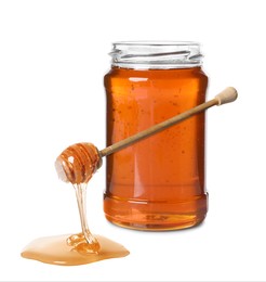 Natural honey dripping from dipper. Jar full of honey on white background