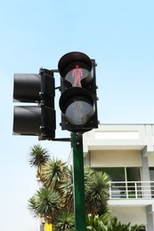 Photo of Traffic lights with red signal near building outdoors