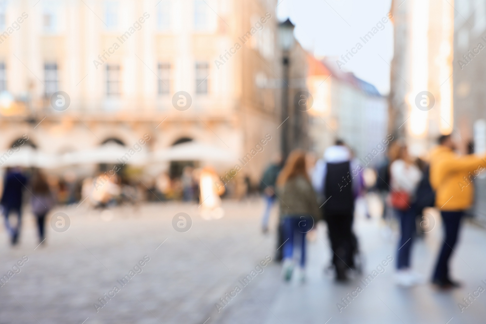 Photo of Blurred view of people walking on city street