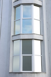 Modern office building with tinted windows. Urban architecture