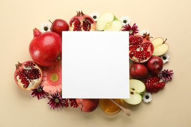 Photo of Flat lay composition with Rosh Hashanah holiday attributes and card on beige background. Space for text