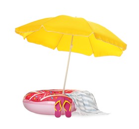 Open yellow beach umbrella, inflatable ring, blanket and flip flops on white background