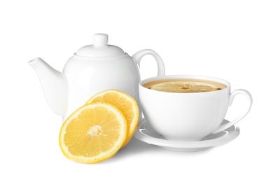 Photo of Teapot and cup of tea with lemon on white background