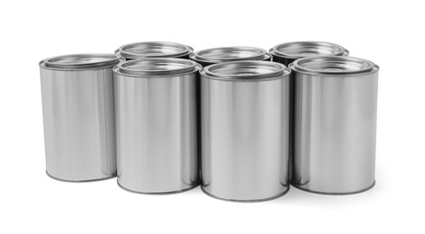 Photo of Many cans of paints on white background