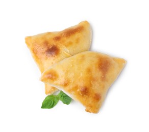 Delicious samosas and basil isolated on white, top view