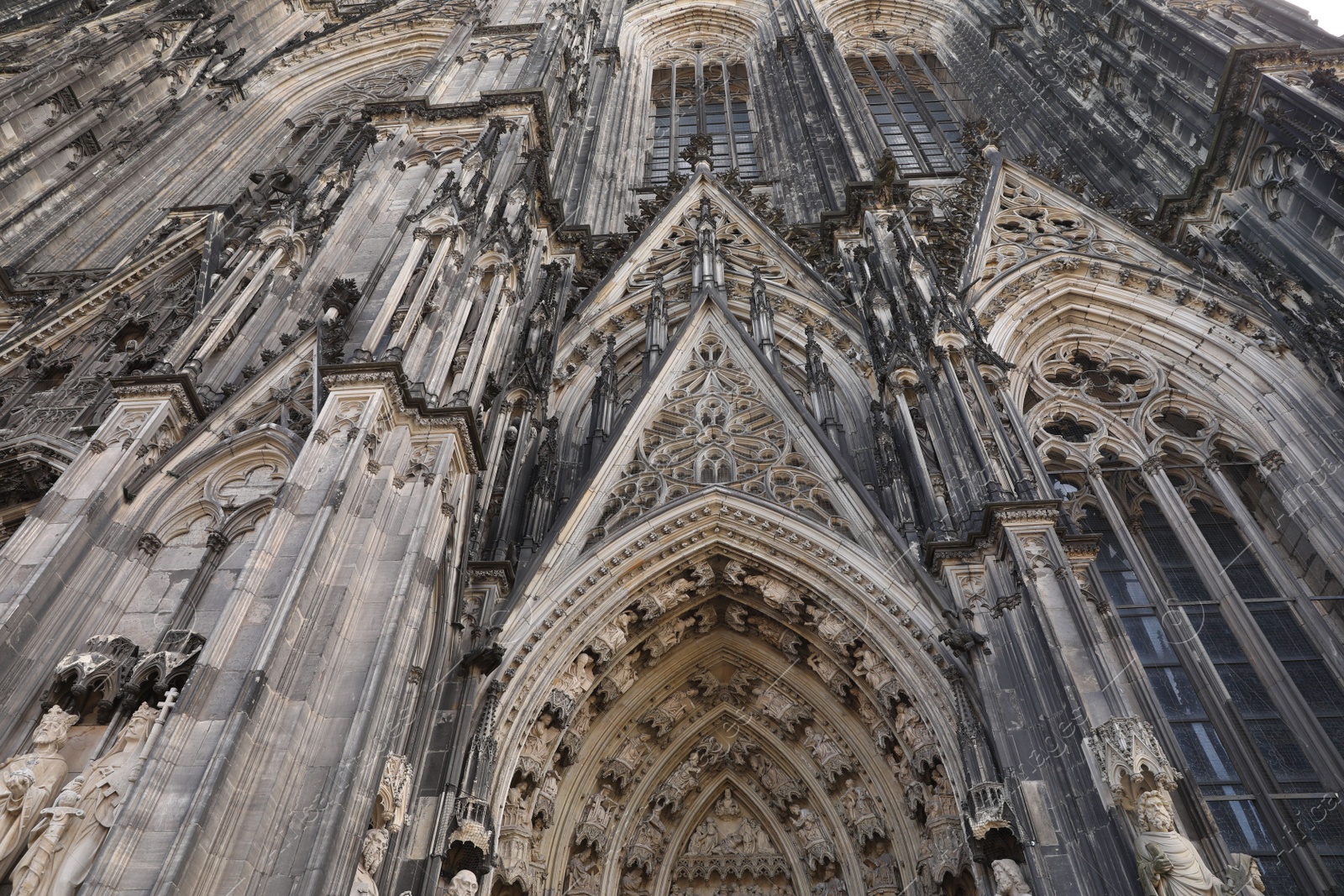 Photo of Cologne, Germany - August 28, 2022: Entrance of beautiful gothic cathedral outdoors