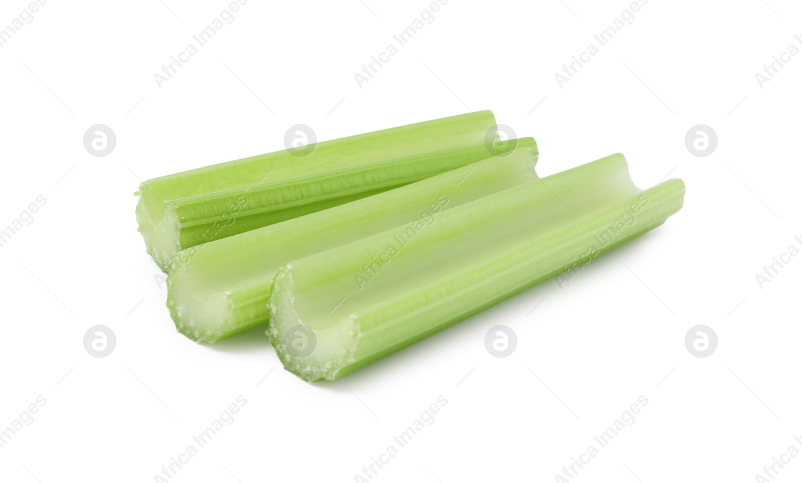 Photo of Fresh green cut celery isolated on white