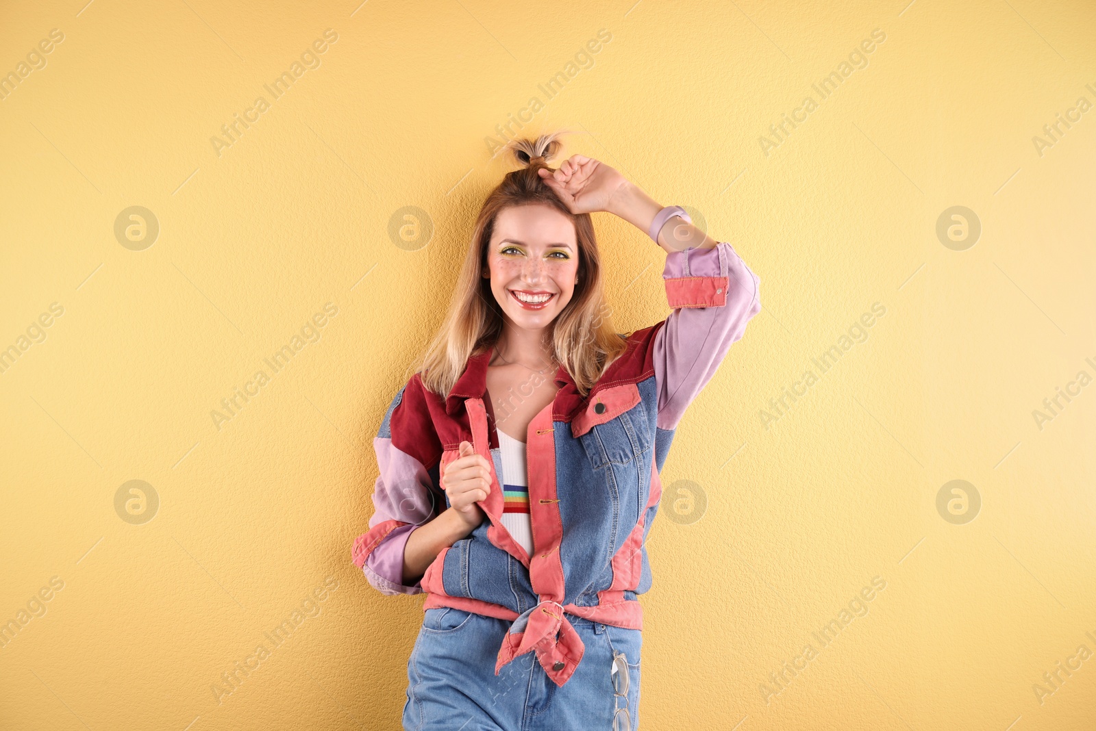 Photo of Beautiful young woman posing on color background. Summer fashion