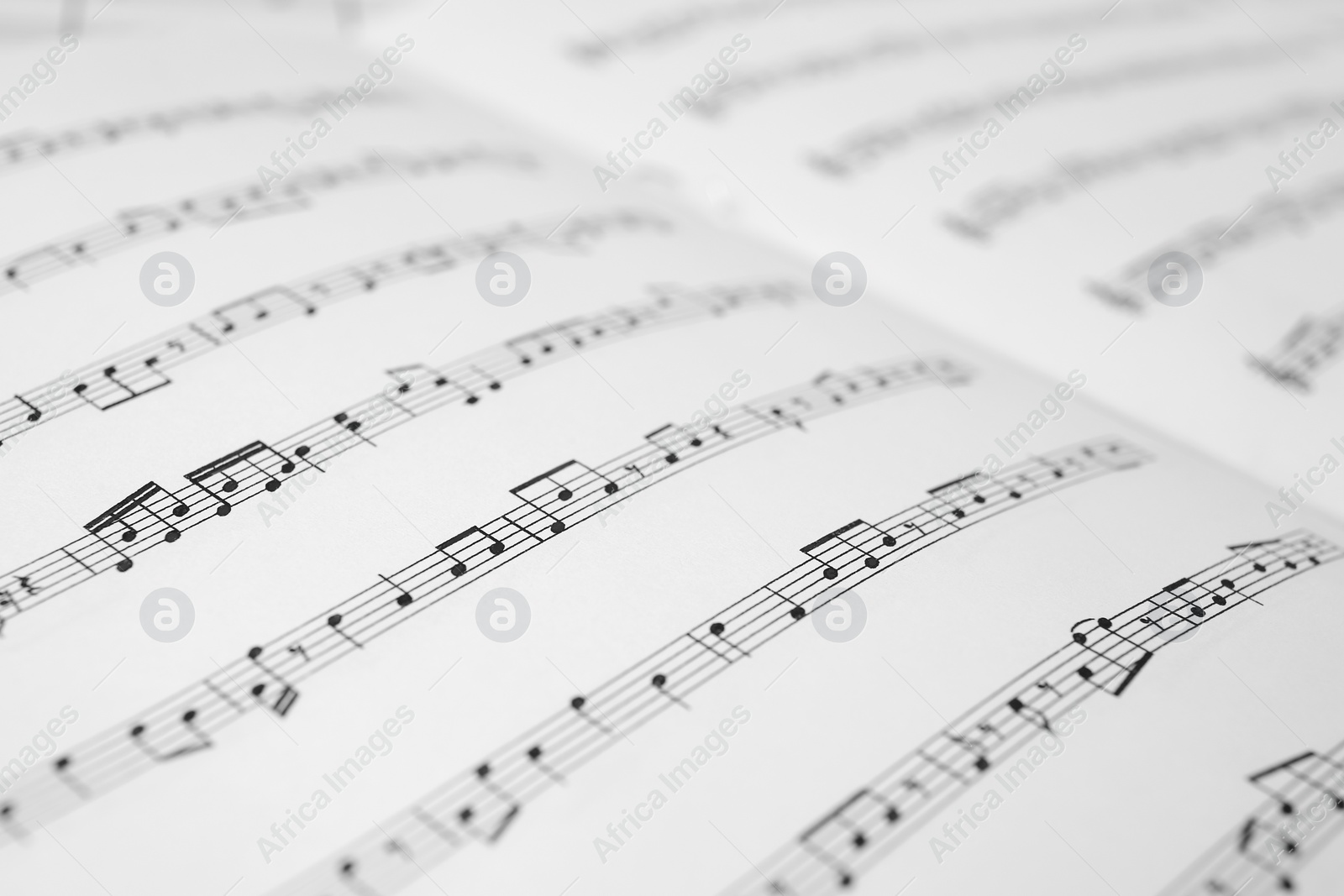 Photo of Sheet music book as background, closeup view