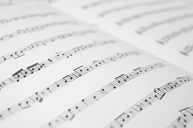 Photo of Sheet music book as background, closeup view