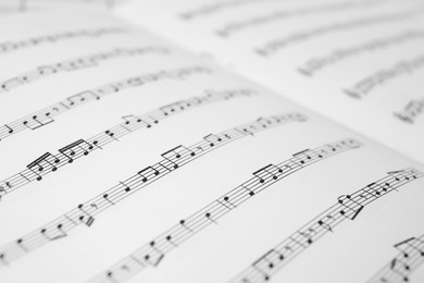 Sheet music book as background, closeup view