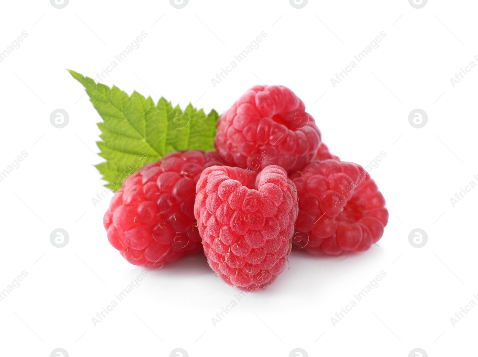 Photo of Pile of fresh ripe raspberries with leaves isolated on white