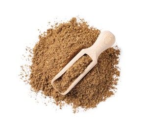 Photo of Scoop and aromatic caraway (Persian cumin) powder isolated on white, top view