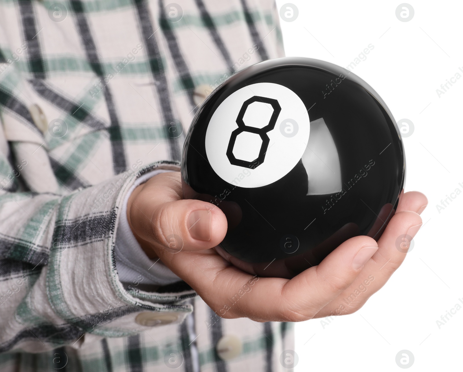 Photo of Woman holding magic eight ball on white background, closeup