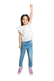 Photo of Cute little girl jumping on light grey background