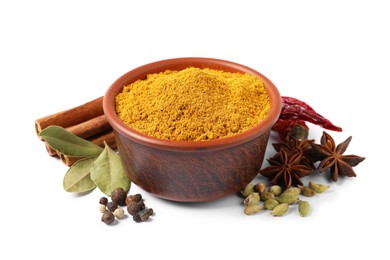 Photo of Curry powder in bowl and other spices isolated on white