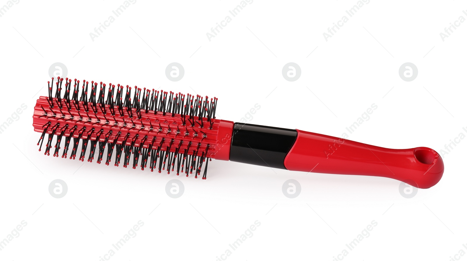 Photo of One new red hairbrush isolated on white