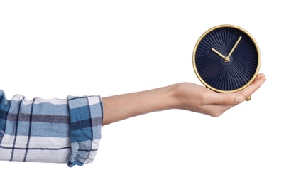 Photo of Young woman holding clock on white background. Time management