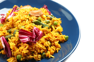 Photo of Delicious rice pilaf with vegetables on white background, closeup