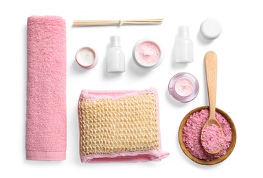 Photo of Flat lay composition with spa cosmetics and towel on white background