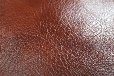 Photo of Texture of brown leather as background, closeup