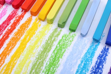 Photo of Colorful pastel chalks on white background,. Drawing materials