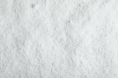 Photo of Pile of white snow as background, top view