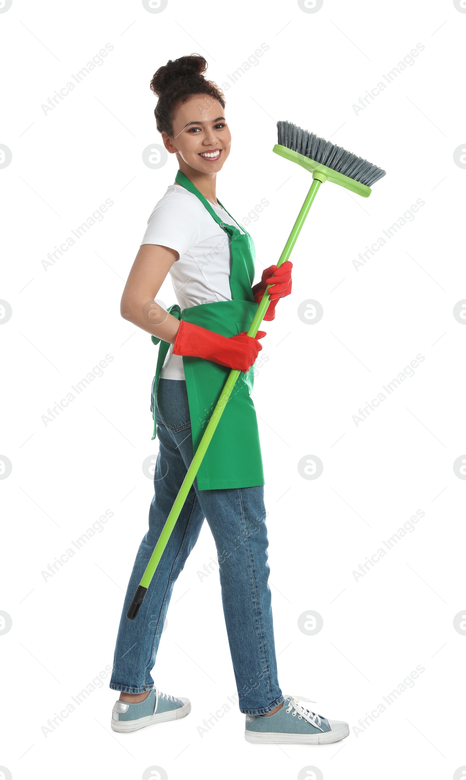 Photo of African American woman with green broom on white background
