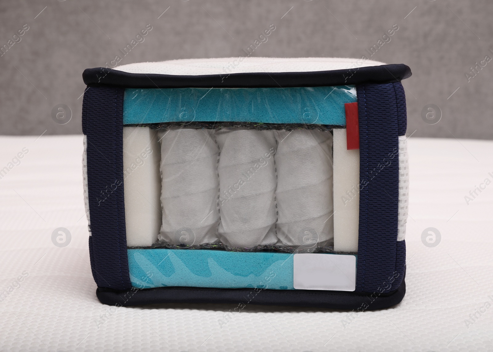 Image of Sample of modern orthopedic mattress on textile