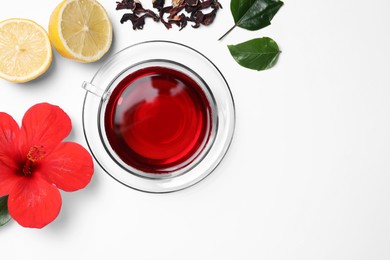 Flat lay composition with delicious hibiscus tea on white background, space for text
