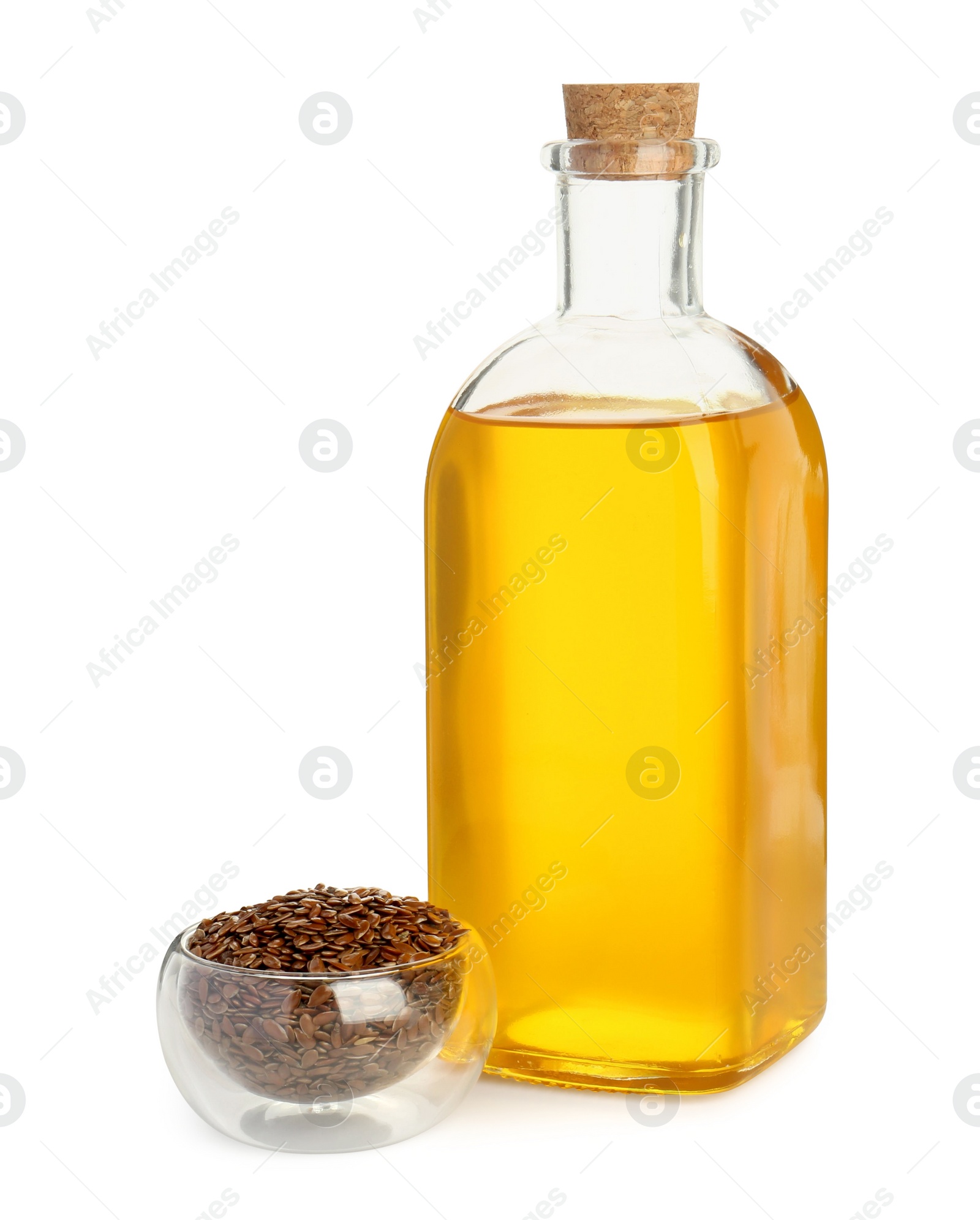 Photo of Vegetable fats. Flax oil in glass bottle and seeds isolated on white