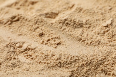Photo of Heap of buckwheat flour as background, closeup