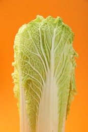 Fresh ripe Chinese cabbage on orange background