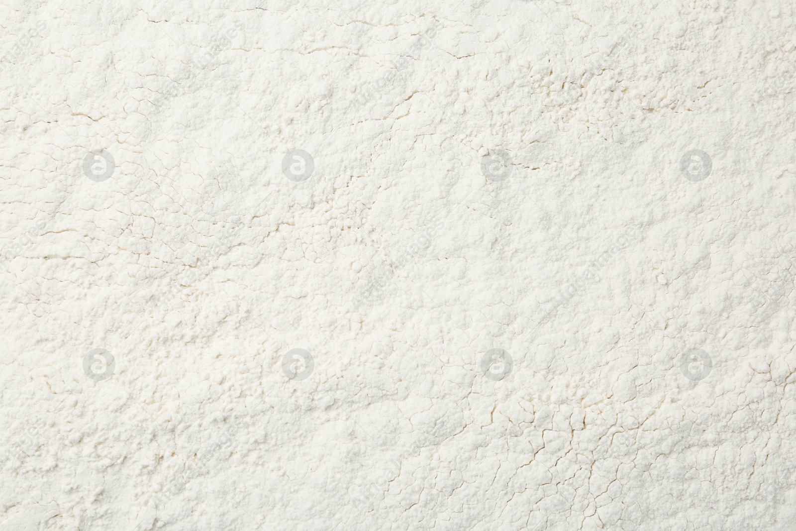 Photo of Pile of organic flour as background, top view