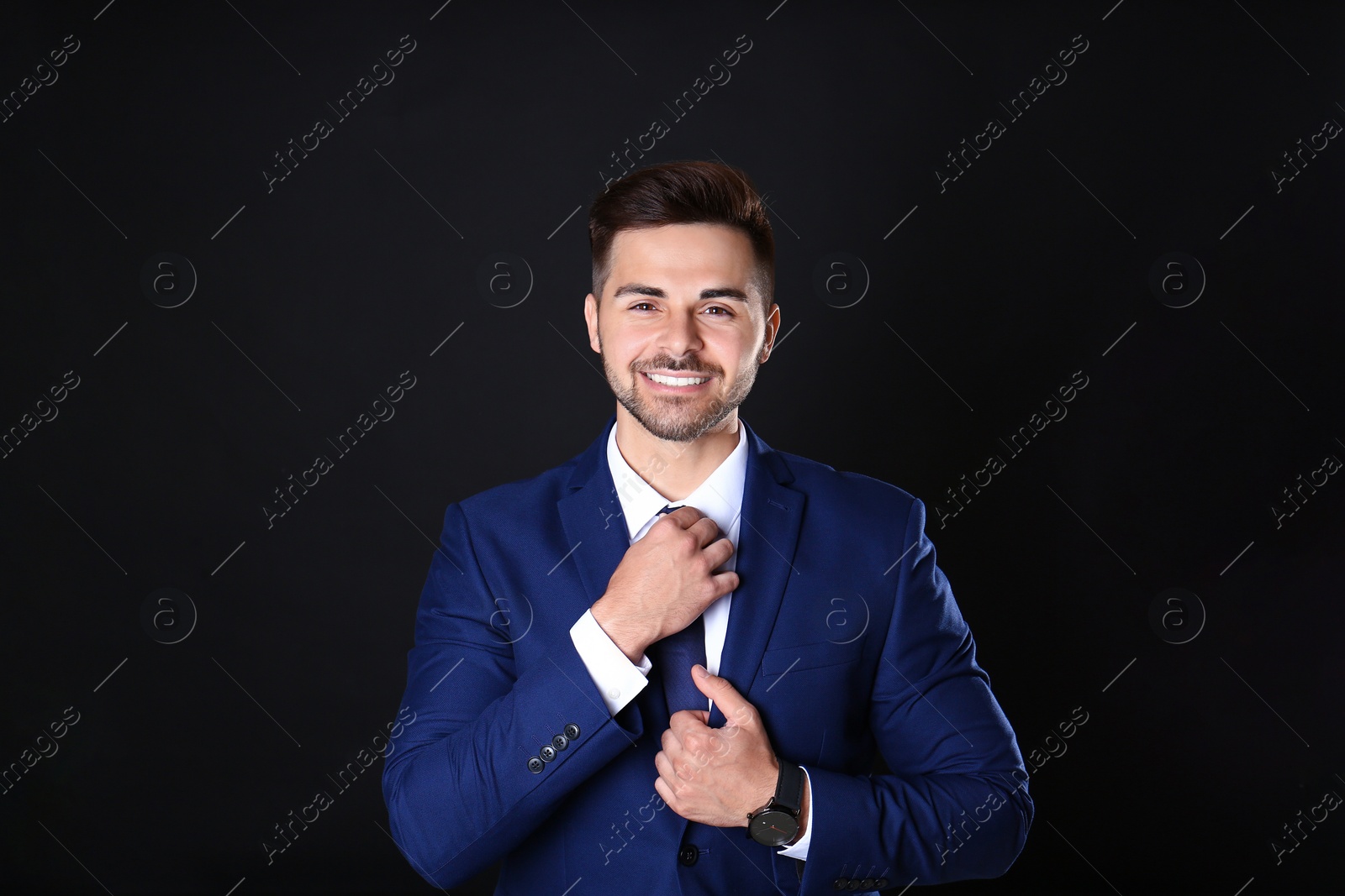 Photo of Portrait of handsome man on black background