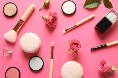 Flat lay composition with products for decorative makeup on pink background