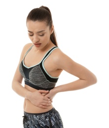 Young woman suffering from pain on white background