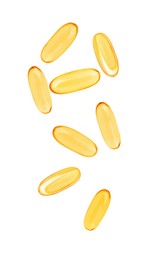 Vitamin. Softgel capsules falling on white background