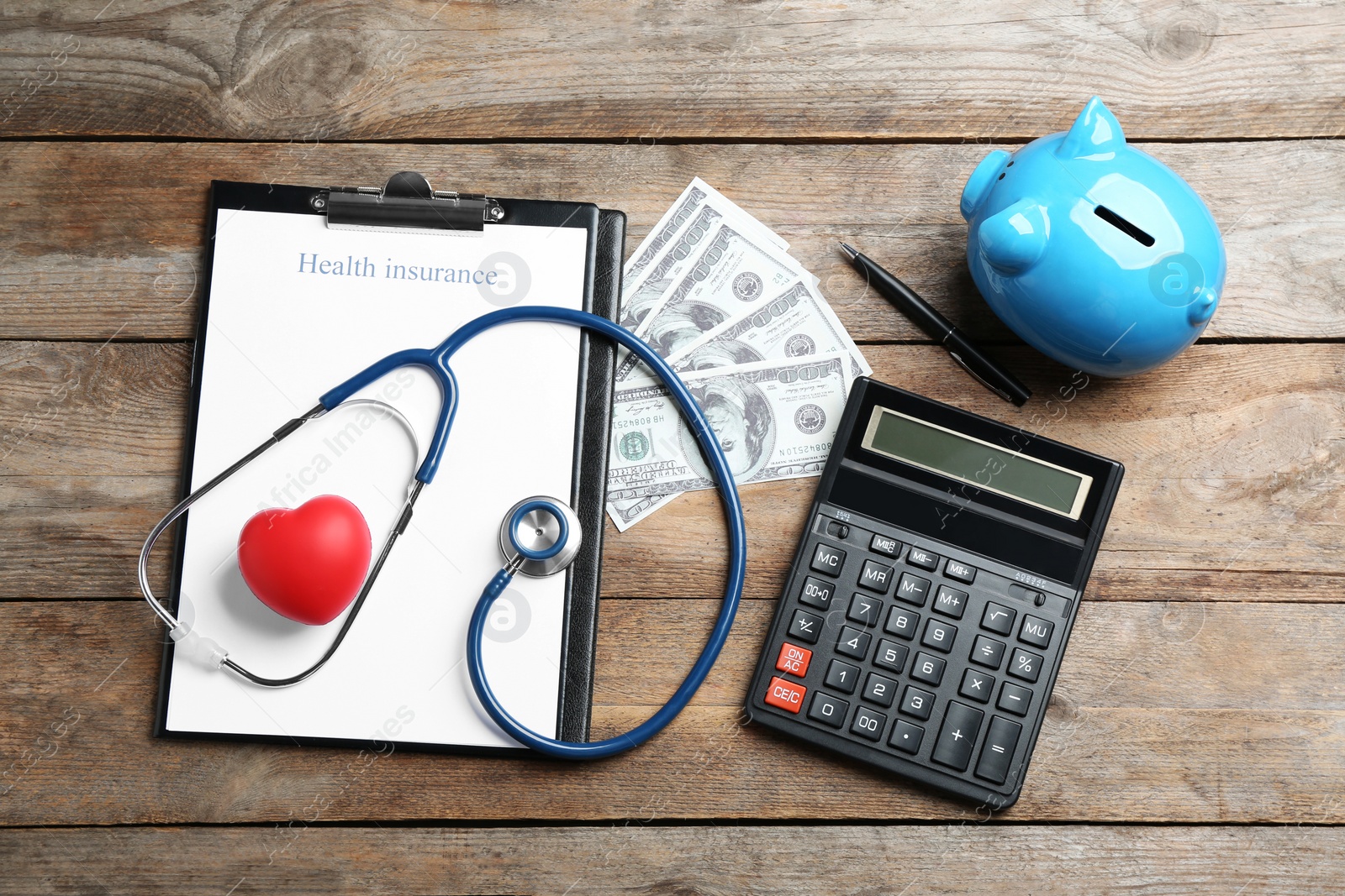 Photo of Flat lay composition with health insurance form and stethoscope on wooden background