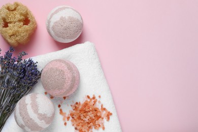 Flat lay composition with bath bombs on pink background, space for text