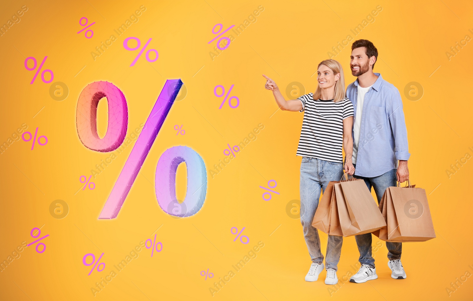 Image of Discount offer. Couple with shopping bags looking at percent signs on orange background
