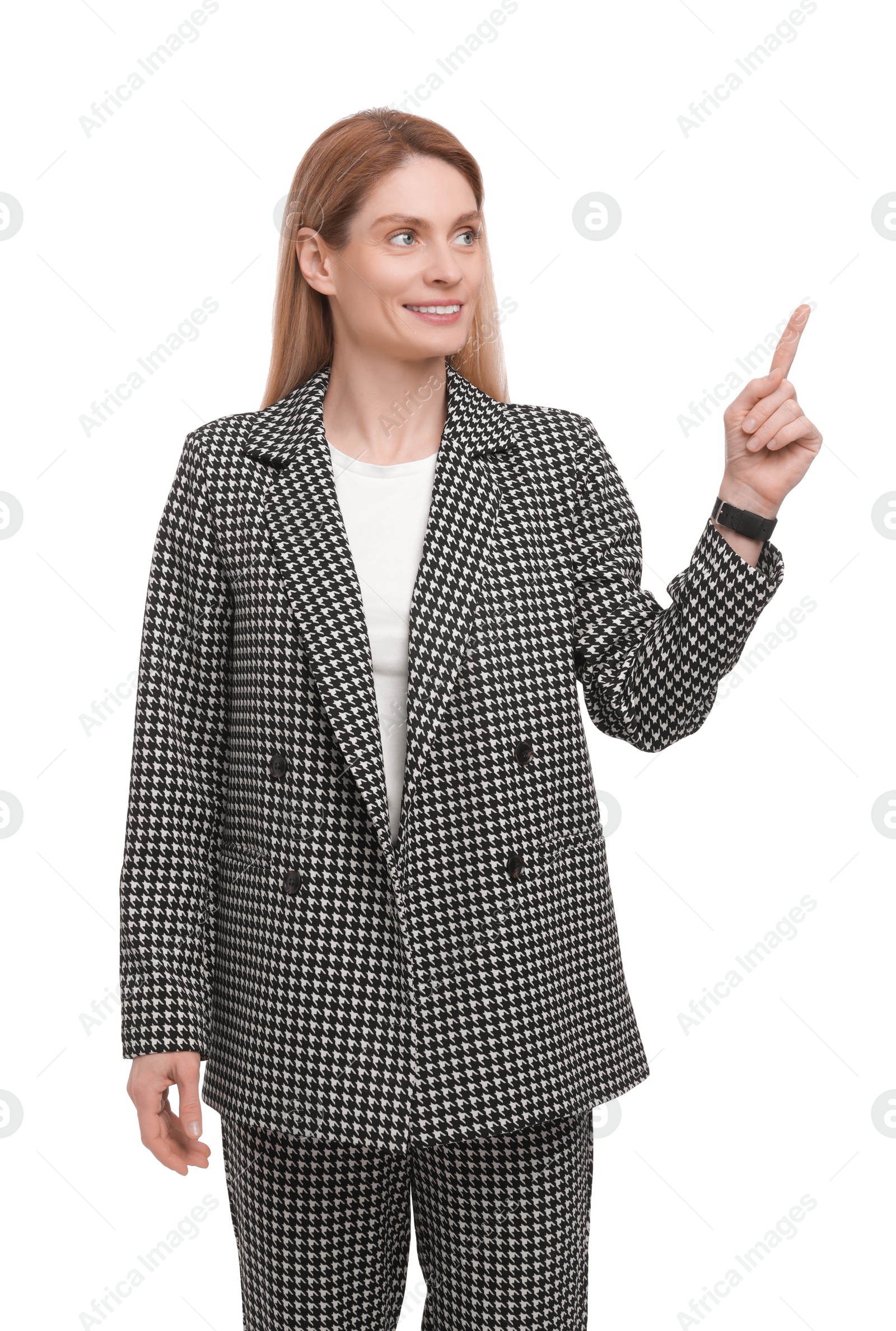 Photo of Beautiful happy businesswoman pointing at something on white background