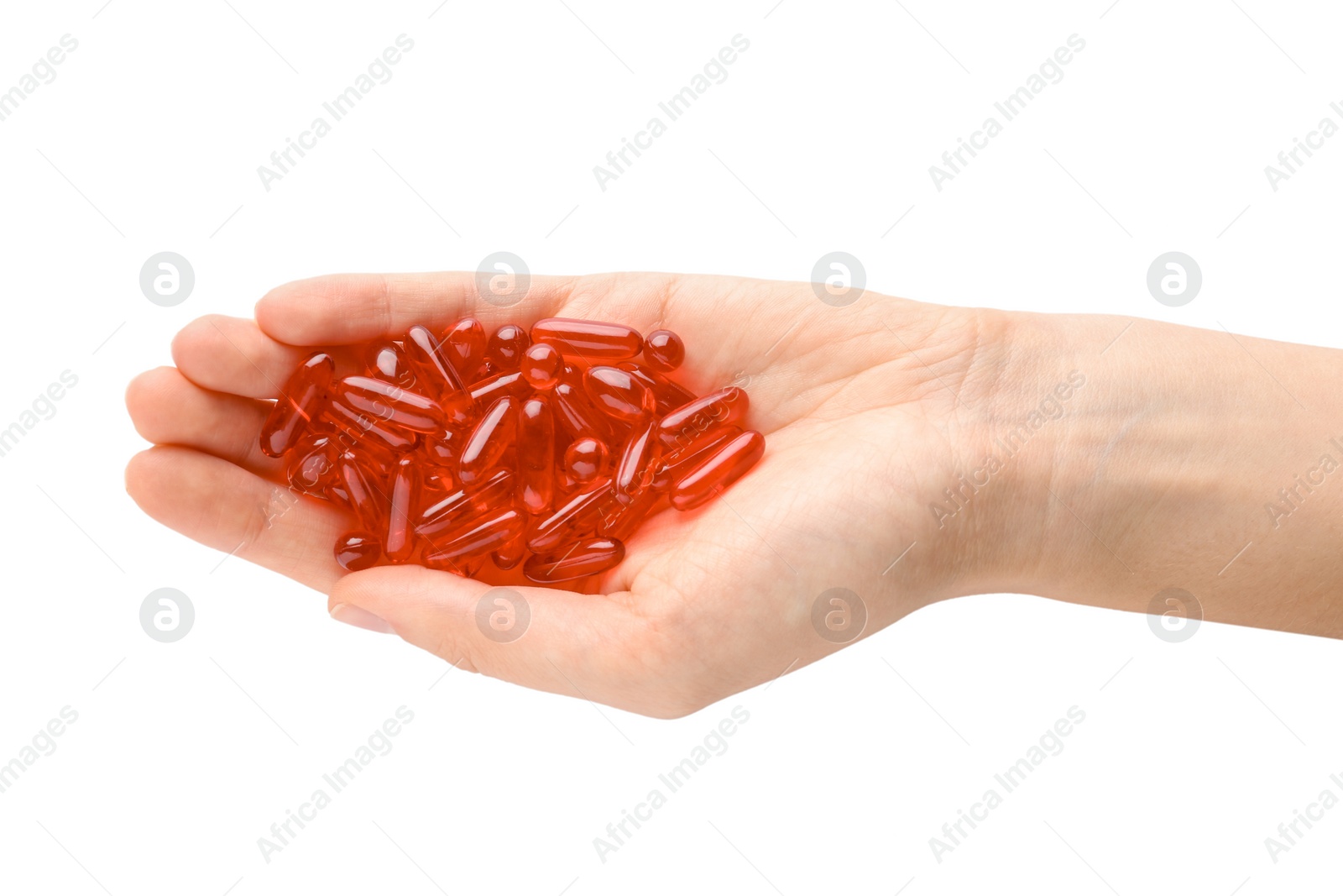 Photo of Woman holding color pills on white background, closeup