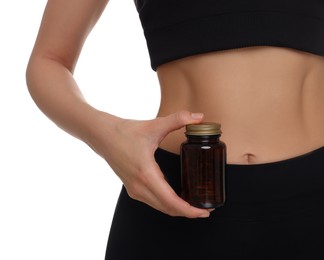 Photo of Woman with bottle of pills on white background, closeup. Weight loss