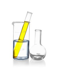 Photo of Glass flask, beaker and test tube with liquids isolated on white